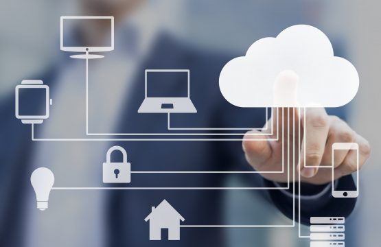 Businessman touching a cloud connected to many objects on a virtual screen, concept about internet of things
